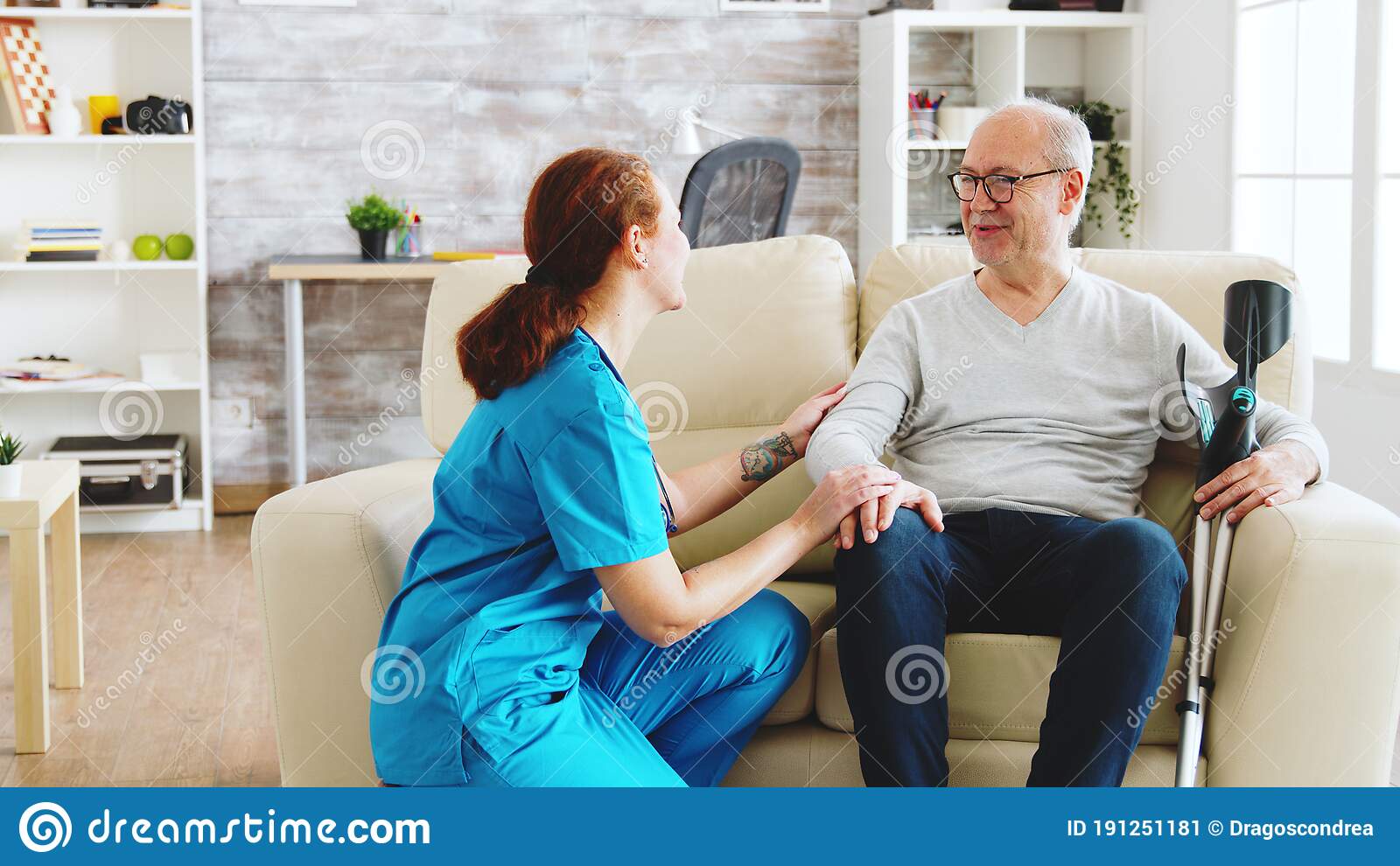 Female Nurse Looking After An Old Patient With Alzheimer Dissease ...